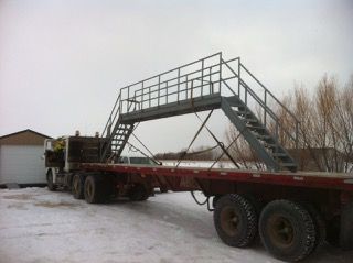Steel stair and platform loaded on a flatbed trailer for delivery